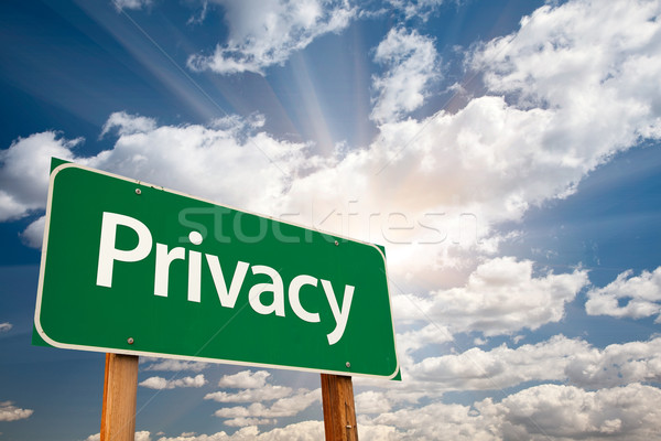 Privacy Green Road Sign Over Clouds Stock photo © feverpitch