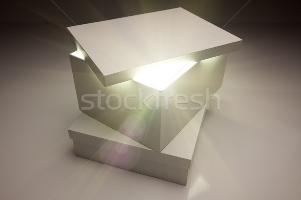 Stock photo: White Box with Lid Revealing Something Very Bright