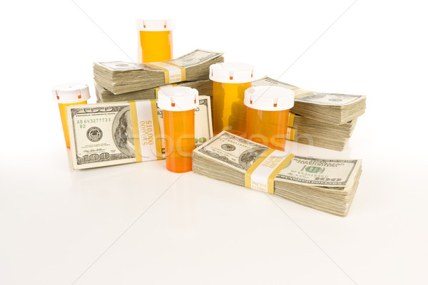 Medicine Bottles and Stacks of Hundreds of Dollars Stock photo © feverpitch