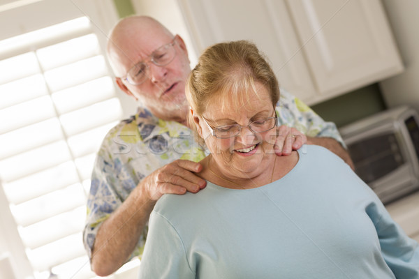 Senior Adult Husband Giving Wife a Shoulder Rub Stock photo © feverpitch