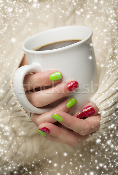 Stock photo: Woman with Red and Green Nail Polish Holding Cup of Coffee