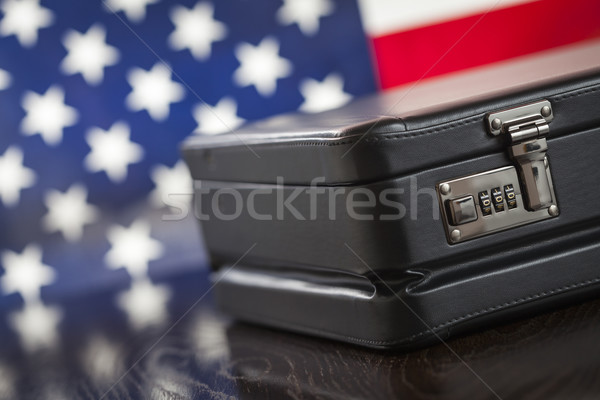 Leather Briefcase Resting on Table with American Flag Behind Stock photo © feverpitch