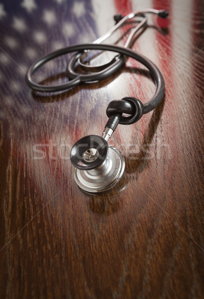Knotted Stethoscope with American Flag Reflection on Table Stock photo © feverpitch
