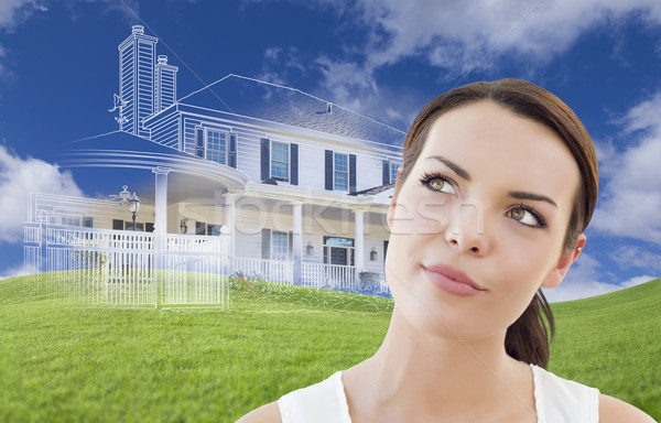 Mixed Race Female Looks Over to Ghosted House Drawing Behind Stock photo © feverpitch