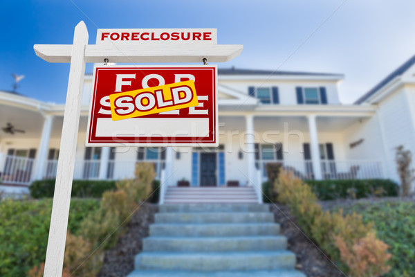 Right Facing Foreclosure Sold For Sale Real Estate Sign in Front Stock photo © feverpitch