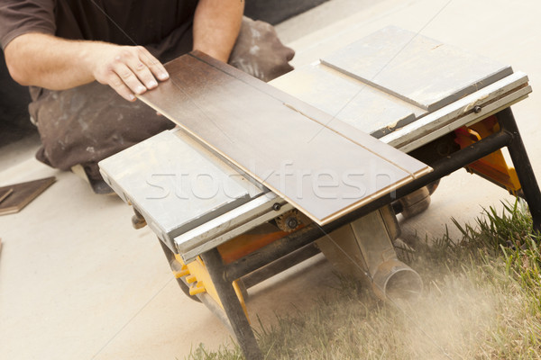 Contractor Using Circular Saw Cutting of New Laminate Flooring Stock photo © feverpitch