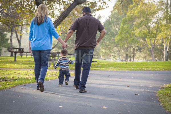 Happy Mixed Race Ethnic Family Walking In The Park Stock photo © feverpitch
