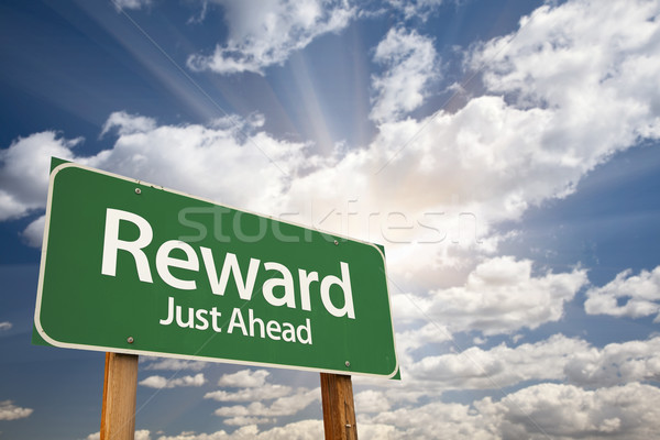 Reward Green Road Sign Against Clouds Stock photo © feverpitch