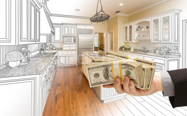 Hand Handing Cash Over Kitchen Design Drawing and Photo Combinat Stock photo © feverpitch