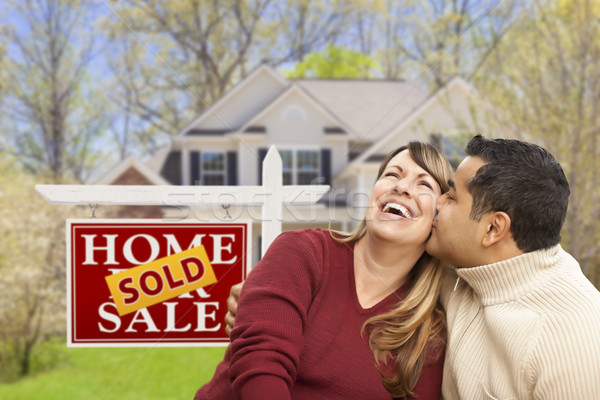 Couple in Front of Sold Real Estate Sign and House Stock photo © feverpitch