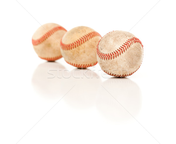 Three Baseballs Isolated on Reflective White Stock photo © feverpitch