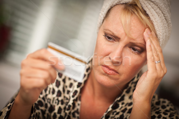 Stock photo: Upset Woman Holding Her Credit Card