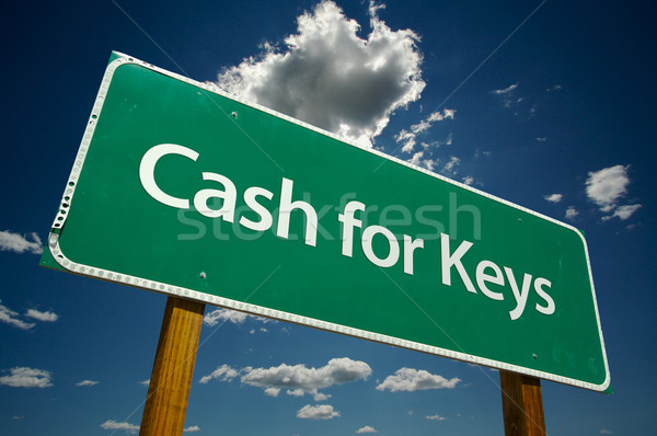 Cash for Keys Green Road Sign Over Clouds Stock photo © feverpitch