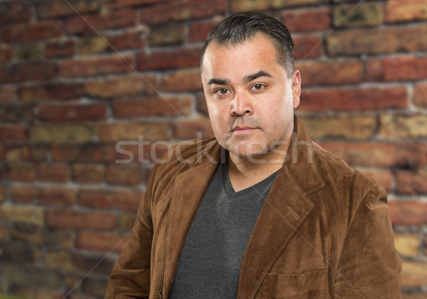 Handsome Young Hispanic Male Headshot Portrait Against Brick Wal Stock photo © feverpitch