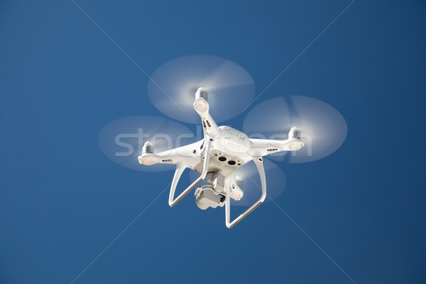 Drone Quadcopter From Below Against A Blue Sky Stock photo © feverpitch