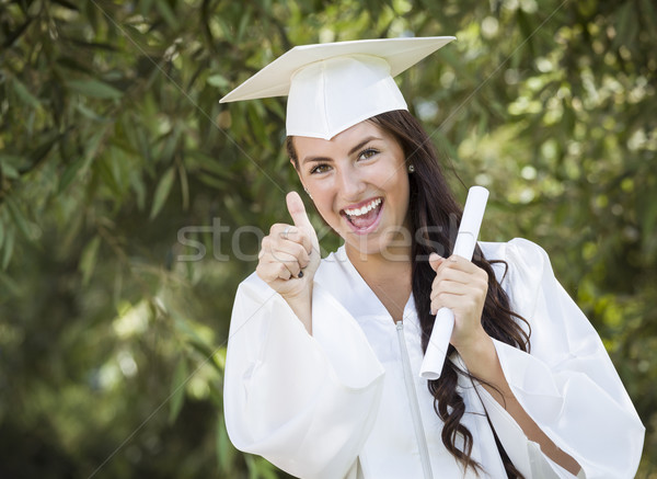 Halfbloed meisje cap toga diploma aantrekkelijk Stockfoto © feverpitch