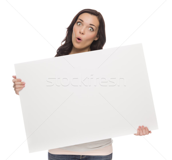Stock photo: Wide Eyed Mixed Race Female Holding Blank Sign on White