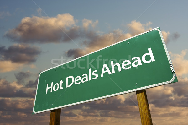 Hot Deals Ahead Green Road Sign Over Clouds Stock photo © feverpitch