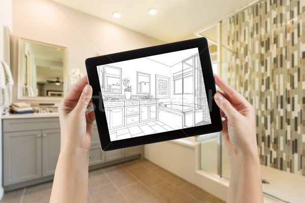 Hands Holding Computer Tablet with Master Bathroom Drawing on Sc Stock photo © feverpitch