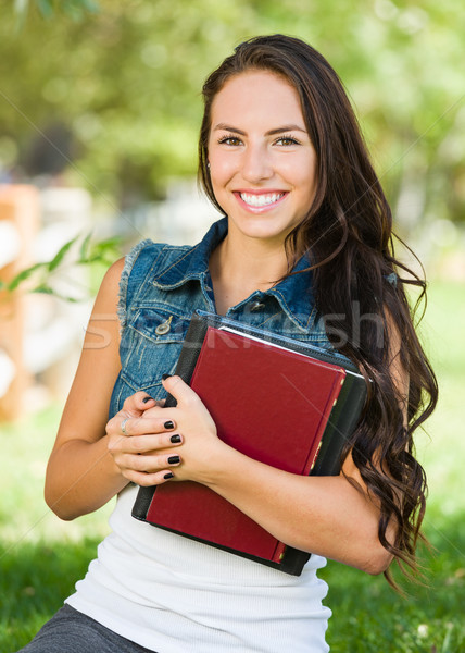 Attractive Smiling Mixed Race Young Girl Student with School Boo Stock photo © feverpitch