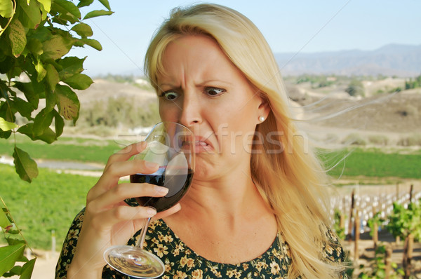 Shocked Attractive Woman Sips Wine Stock photo © feverpitch