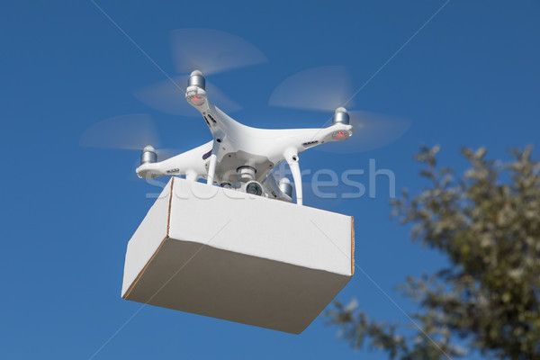 Unmanned Aircraft System (UAS) Quadcopter Drone Carrying Blank P Stock photo © feverpitch