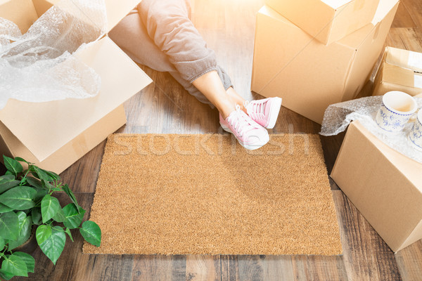 Woman Wearing Sweats Relaxing Near Home Sweet Home Welcome Mat,  Stock photo © feverpitch