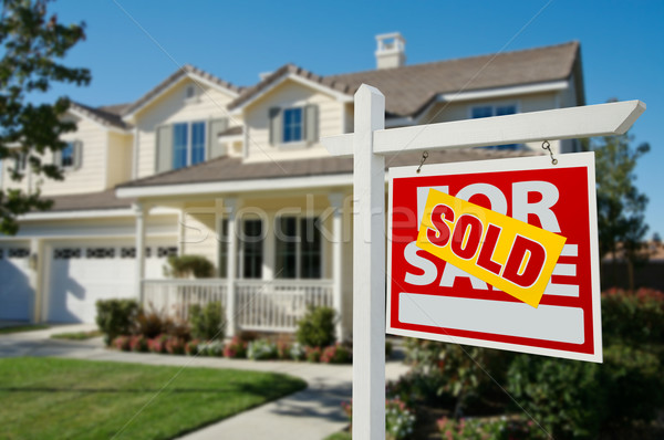 Sold Real Estate Sign and House Stock photo © feverpitch