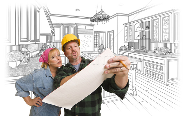 Contractor Discussing Plans with Woman, Kitchen Drawing Behind Stock photo © feverpitch