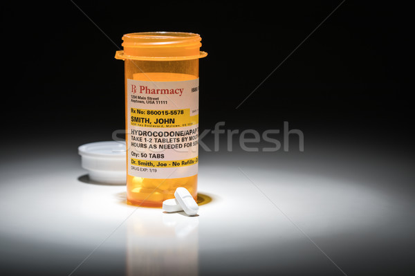 Hydrocodone Pills and Prescription Bottle with Non Proprietary L Stock photo © feverpitch