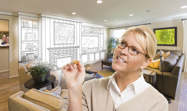 Stock photo: Woman with Pencil Over Custom Room and Design Drawing