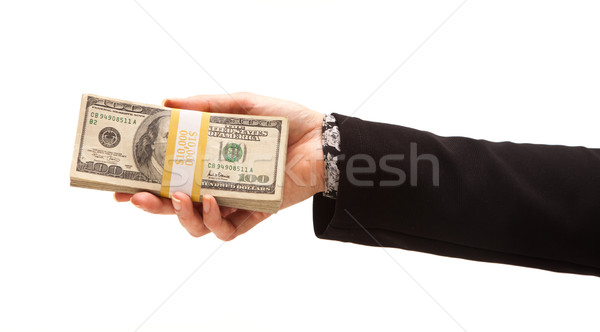 Stock photo: Woman Handing Over Hundreds of Dollars