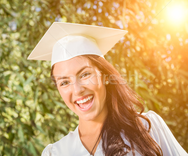 Happy Graduating Mixed Race Girl In Cap and Gown Stock photo © feverpitch