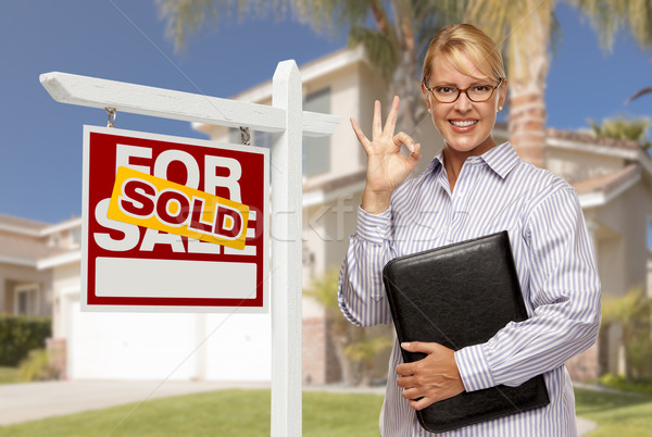 Real Estate Agent in Front of Sold Sign and House Stock photo © feverpitch