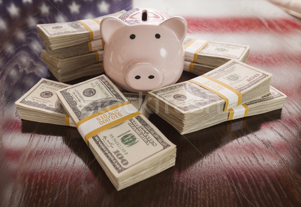 Stock photo: Thousands of Dollars, Piggy Bank, American Flag Reflection on Ta