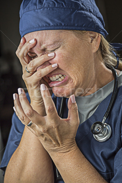 Agonizing Crying Female Doctor or Nurse Stock photo © feverpitch
