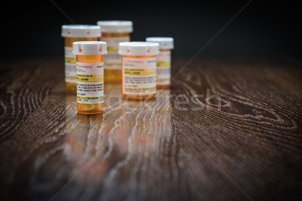 Választék vényköteles gyógyszer üvegek tükröződő fából készült felület Stock fotó © feverpitch