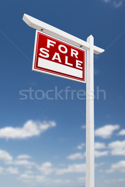 Left Facing For Sale Real Estate Sign on a Blue Sky with Clouds. Stock photo © feverpitch