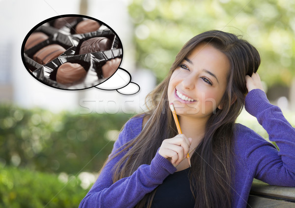 Pensive Woman with Chocolate Candy Inside Thought Bubble Stock photo © feverpitch
