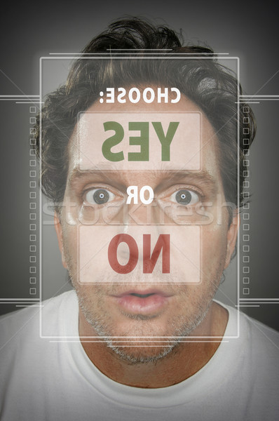 Dumbfounded Looking Man In Front of Touch Screen Choosing Yes of Stock photo © feverpitch