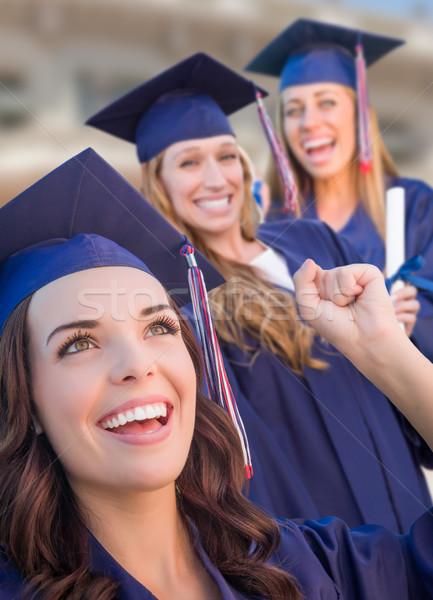 Stock photo: Happy Graduating Group of Girls In Cap and Gown Celebrating on C