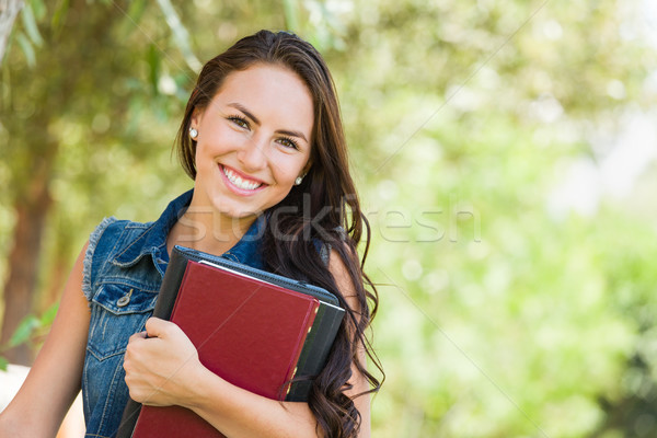 Attractive Smiling Mixed Race Young Girl Student with School Boo Stock photo © feverpitch