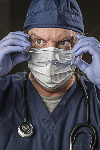 Stock photo: Determined Looking Doctor or Nurse with Protective Wear and Stet