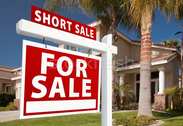 Stock photo: Short Sale Real Estate Sign and House - Left