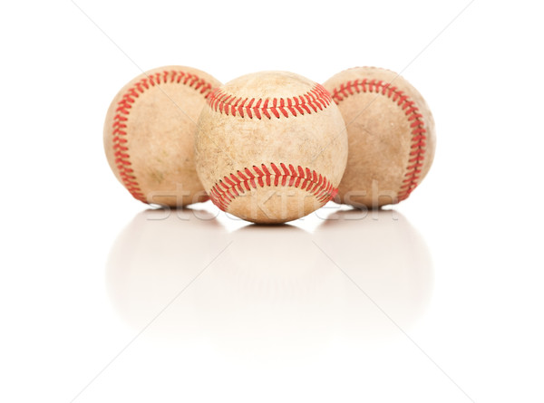 Three Baseballs Isolated on Reflective White Stock photo © feverpitch