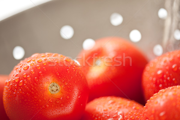 Fresh, Vibrant Roma Tomatoes in Colander with Water Drops Stock photo © feverpitch