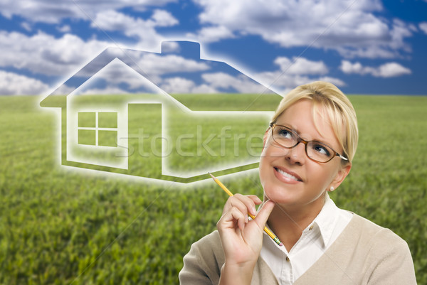 Woman and Grass Field with Ghosted House Figure Behind Stock photo © feverpitch