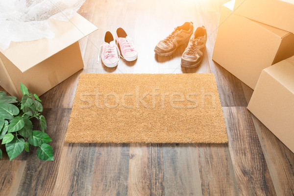Home Sweet Home Welcome Mat, Moving Boxes, Women and Male Shoes  Stock photo © feverpitch