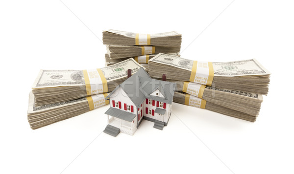 Small House with Stacks of Hundred Dollar Bills Stock photo © feverpitch