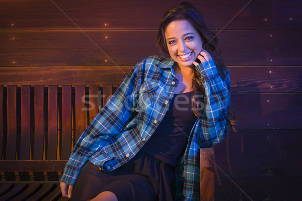 Stock photo: Mixed Race Young Adult Woman Portrait Sitting on Wood Bench